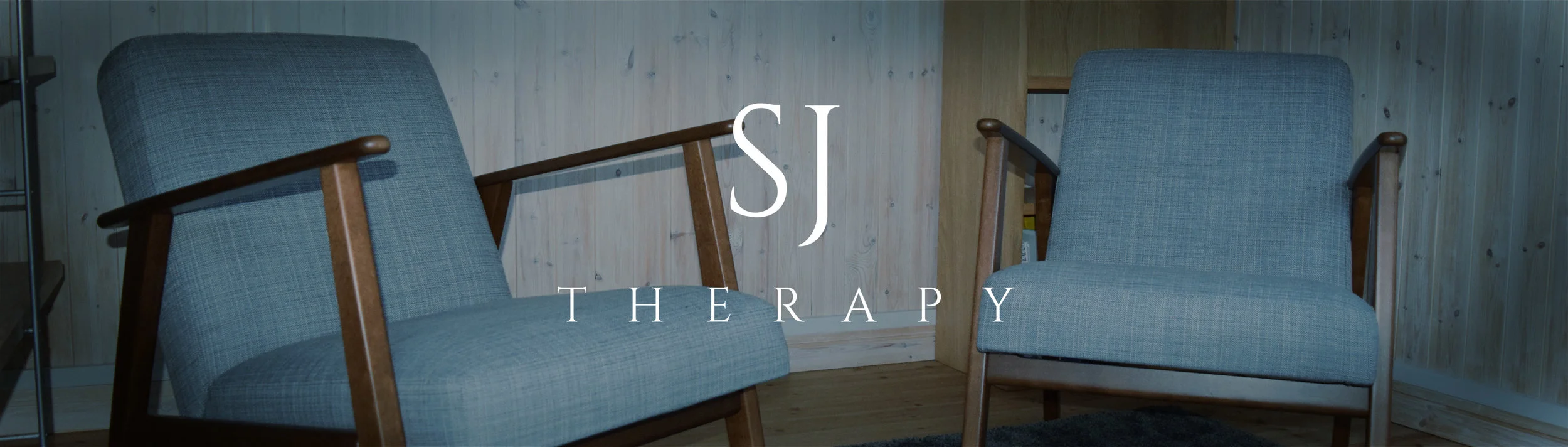Two teal chairs in therapy room